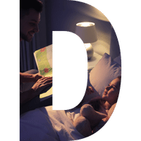 father and son reading at bedtime