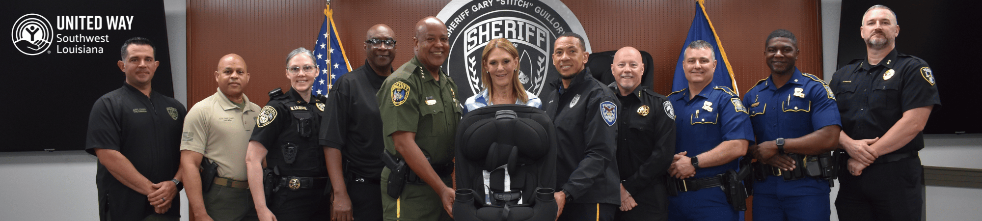 group of law enforcement with car seat