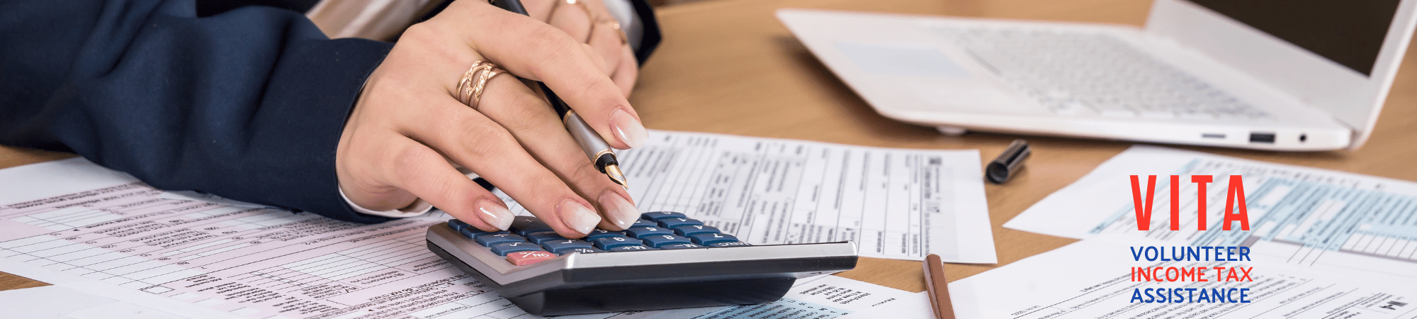 hand preparing taxes